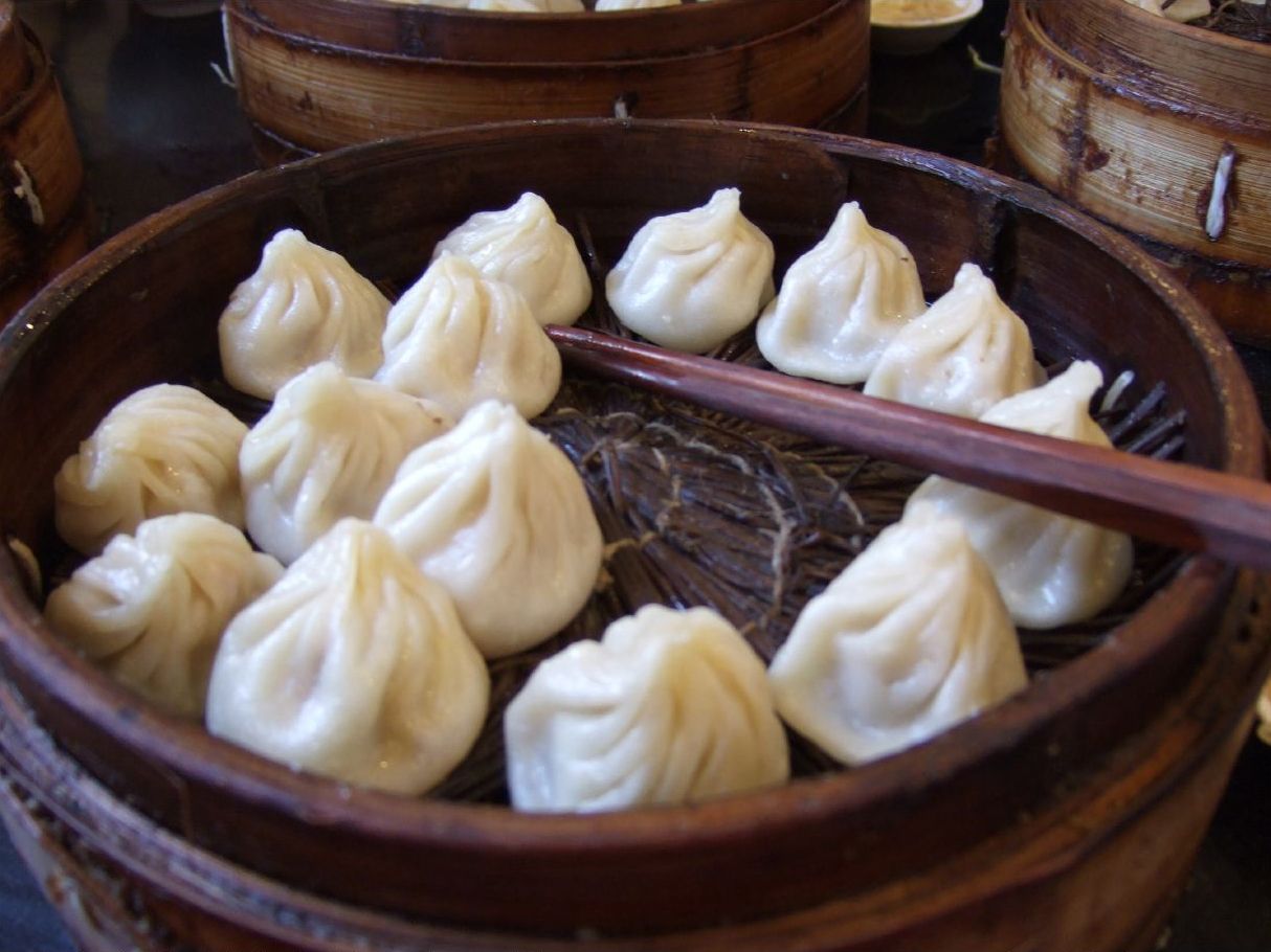 Shanghai xiaolongbao soup dumplings in a bamboo steamer